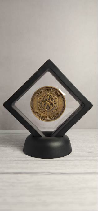 Floating brass coin display